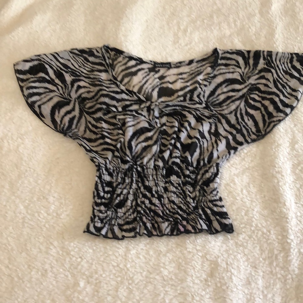 Wet Seal zebra type print blouse with tie in the front open circle  chest